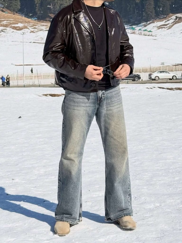 The Black Leather Jacket and Relaxed Jeans Outfit